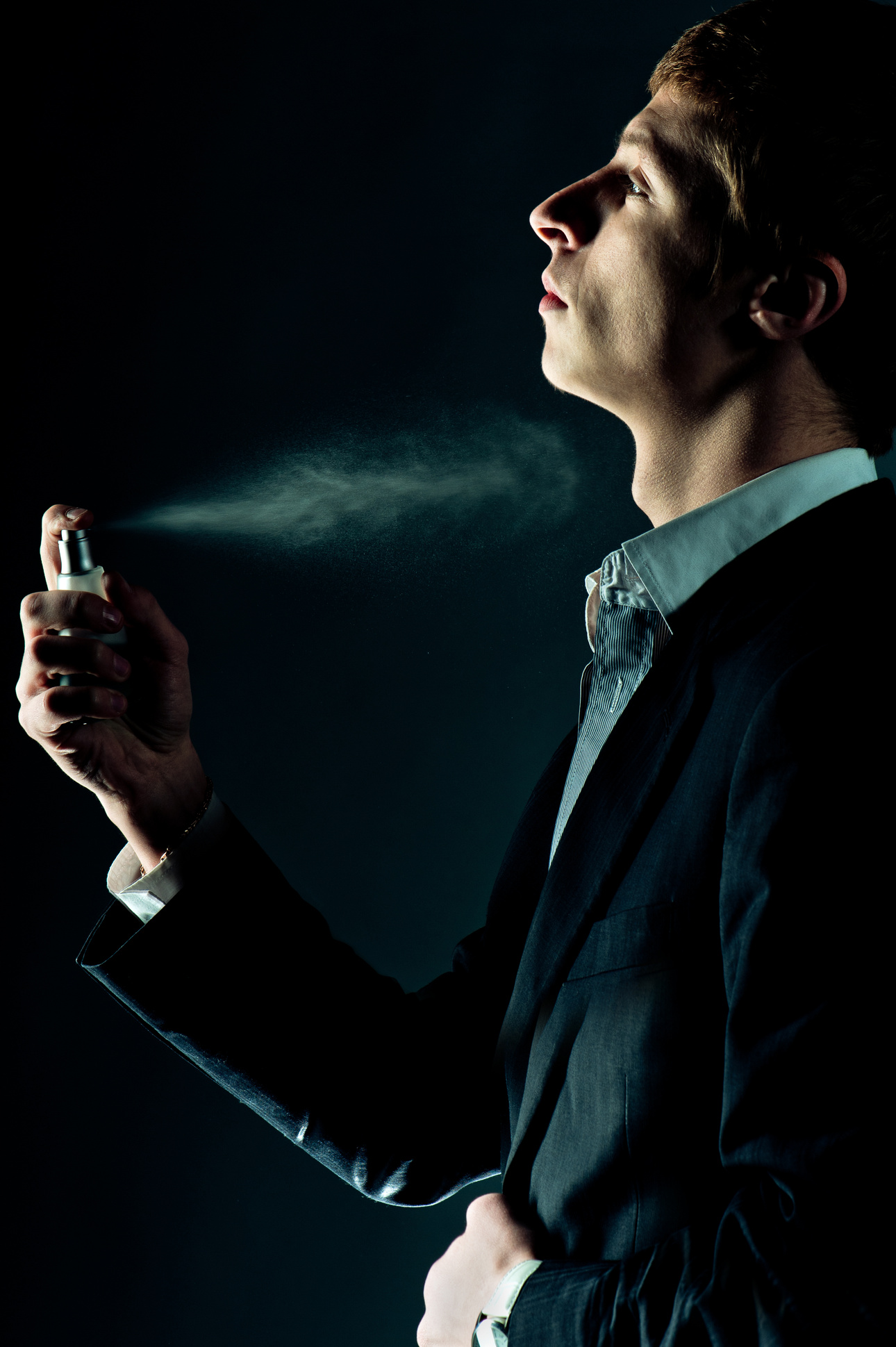 Man spraying perfume